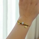 Браслет титан под Pandora с сердечками арт.tr1811 золото